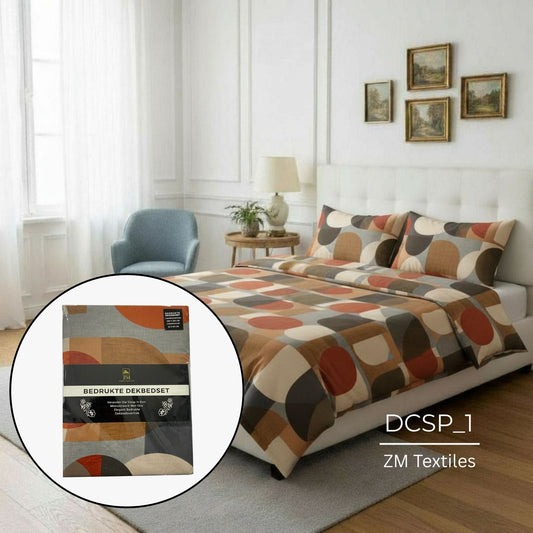 Bedroom with a bed featuring a patterned duvet cover, ZM Textiles packaging, and decorative elements.