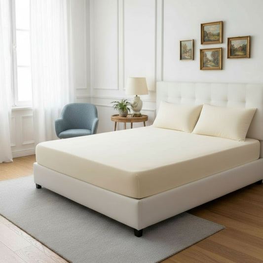 Sand jersey cotton fitted sheet on a bed – ZM Textiles Belgium
