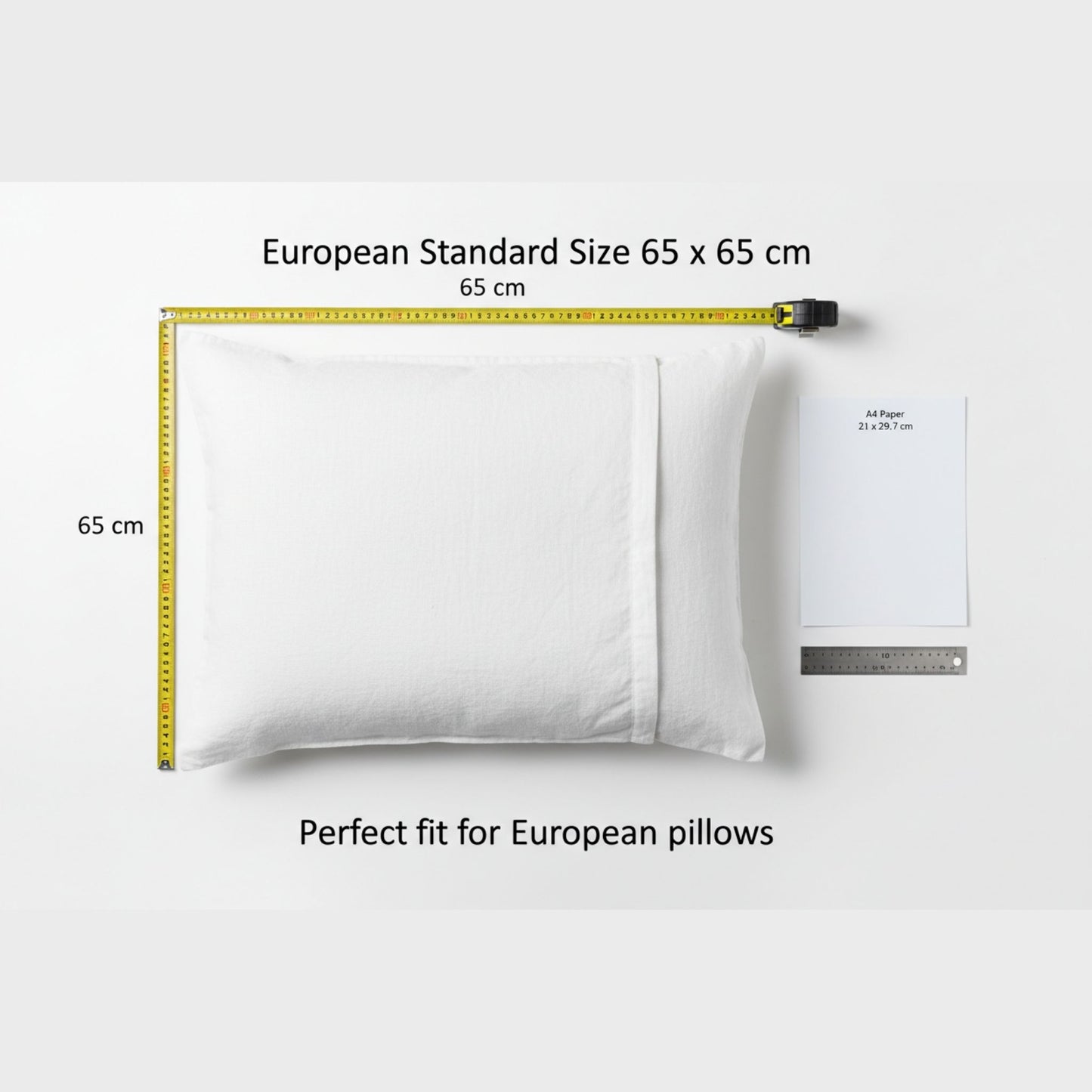 white pillow case with a measuring tape indicating the European pillows standard size of 65 x 65 cm on a light gray background, featuring ZM Textiles Belgium Pillow case size guide.