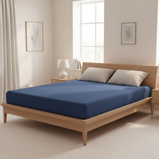 Navy flannel cotton fitted sheet on a wooden bed – ZM Textiles Belgium