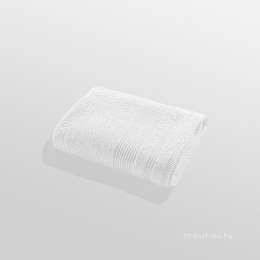 White textured fabric roll on a light gray background, featuring ZM Textiles Belgium 500GSM Ultra Absorbent Towels.